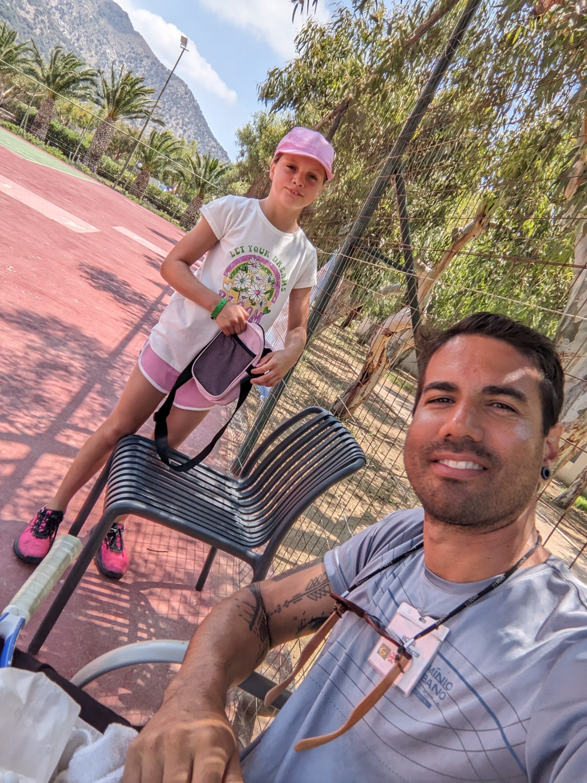 Brazilian tennis coach in club with kids